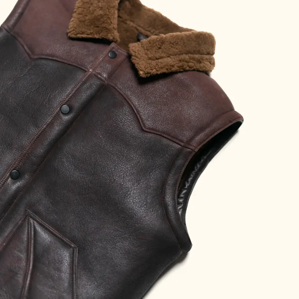 Leather shearling vest button front closure detail
