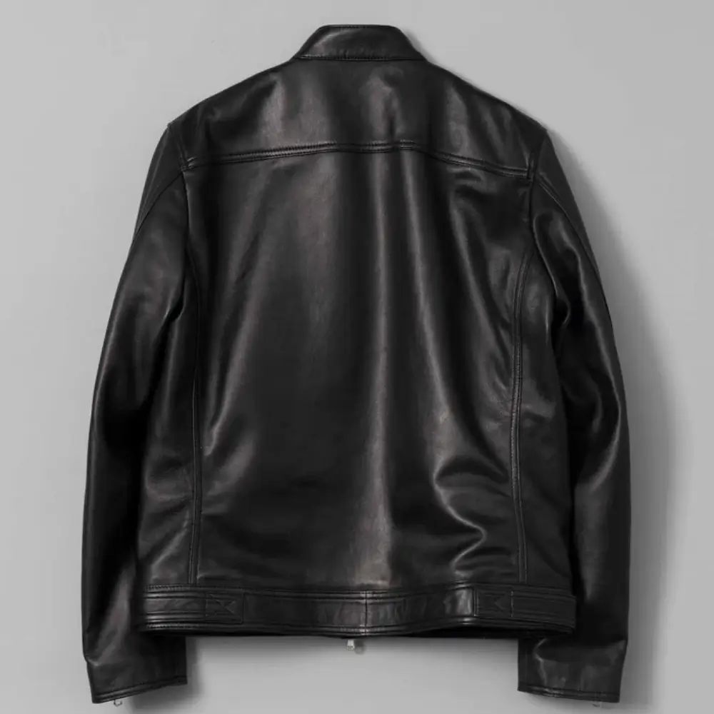 Snap-tab-waist-adjuster-detail-at-hem-of-leather-rider-jacket.