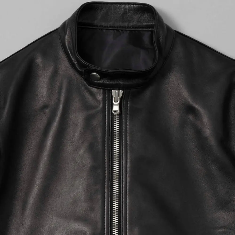Stand-collar-and-front-zip-closure-detail-on-leather-rider-jacket